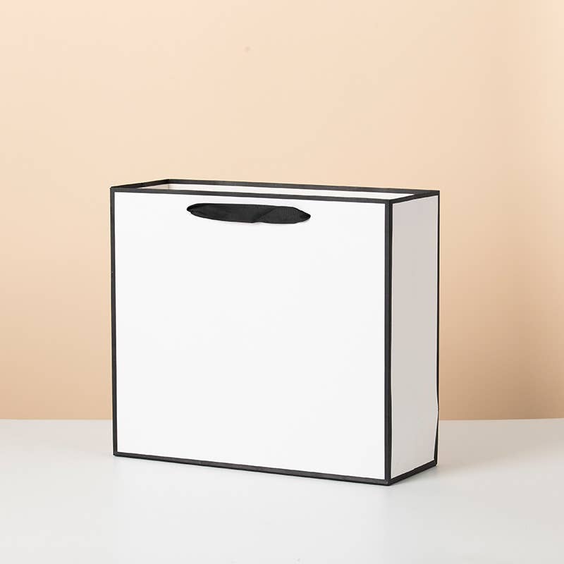 ByHome - Venta al por mayor Bolsas de celofán - Bolsa de regalo blanca con borde negro y papel de seda gratis1