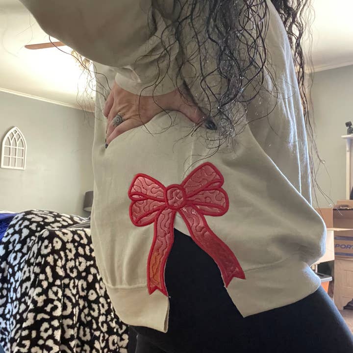 Basil & Burch - Wholesale Sweatshirt - Women's - Side bow cut out embroidered crewneck. 1