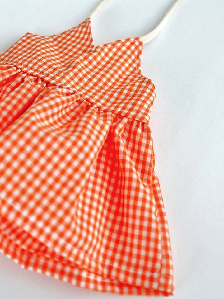 Orange Gingham Peplum for wholesale by The Baby Bird Boutique