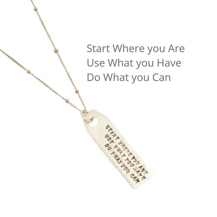 Arthur Ashe Luggage Tag Quote Necklace "Start where you are, Use what you have, Do what you can" for wholesale by Chocolate and Steel