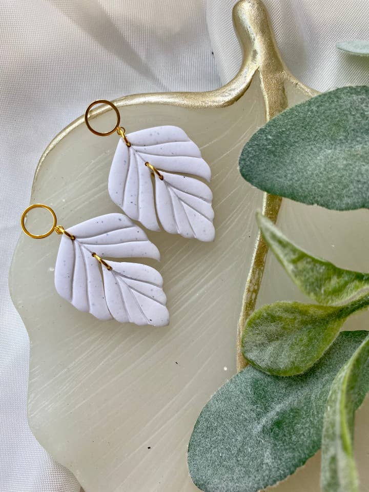 Cuelgan plumas para venta al por mayor de Rachel Ray Co