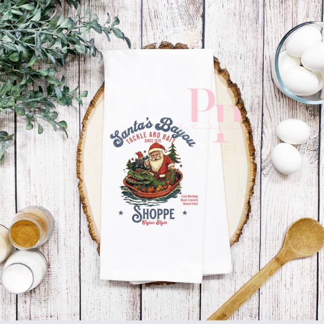 Santa bait and tackle shop tea towel for wholesale by The Panicked Pelican
