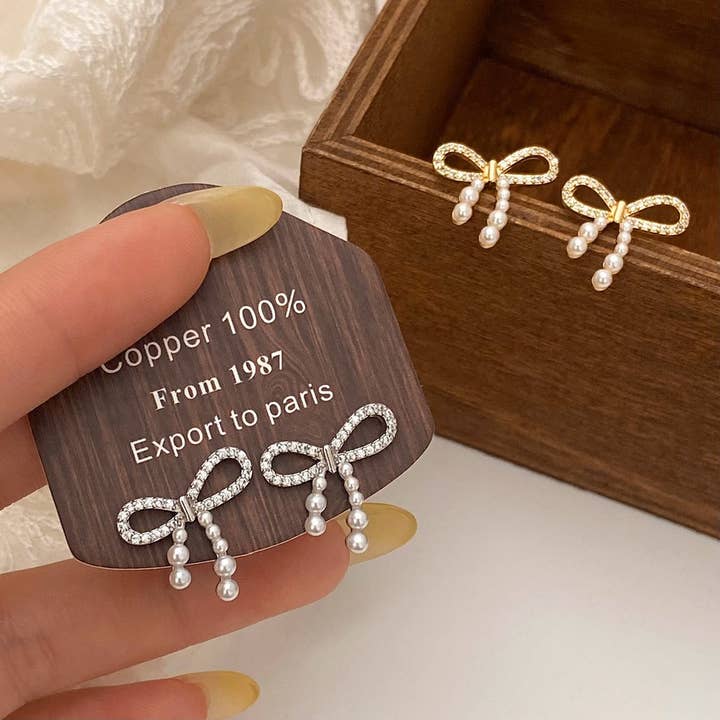 TRENDY RETRO BOWKNOT DIAMOND PEARL EARRINGS_CWAJE2973 for wholesale by ACCITY