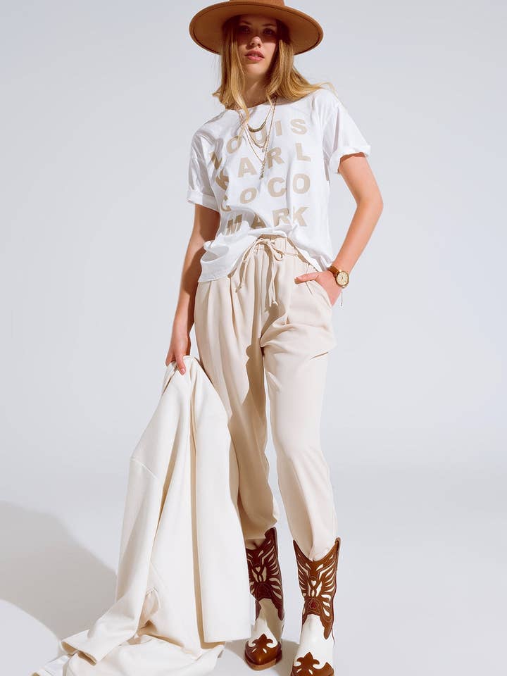 White Creme T-shirt With famous Names Logos At The Front for wholesale on Faire