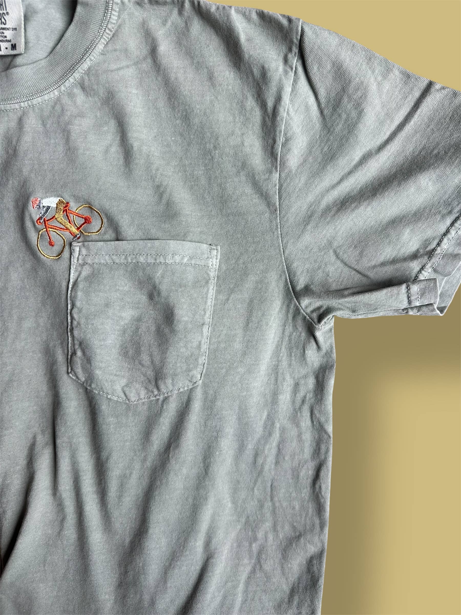 Little Lamb Designs - Wholesale T-Shirt - Unisex - Embroidered tshirt - Mountain Biker going down Pocket1