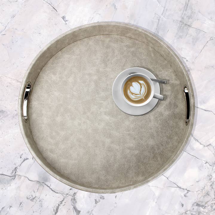 Round beige synthetic leather ray tray with stainless steel handles for wholesale by Signature Home Collection GmbH