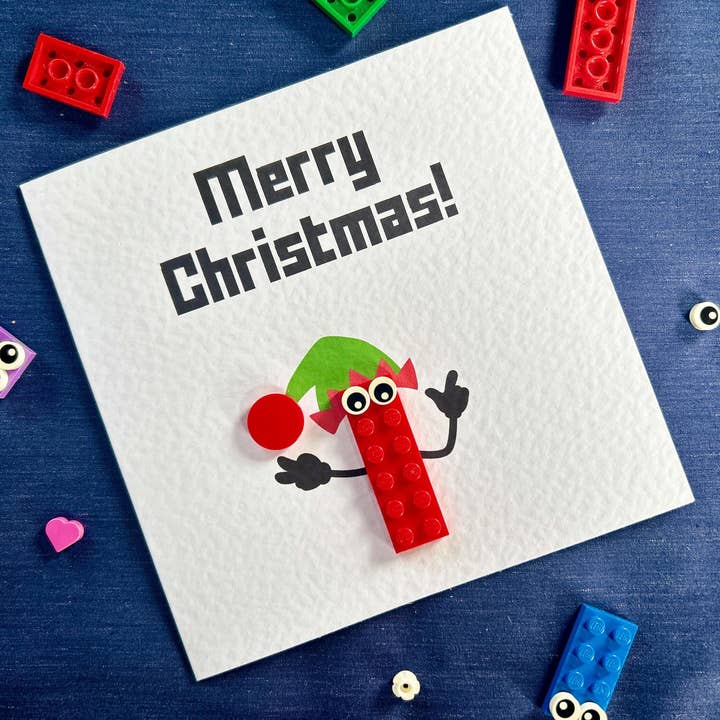 Stud Universe – Großhandel Weihnachtskarte – Festliche LEGO-Karte mit frecher Elfe aus LEGO-Stücken