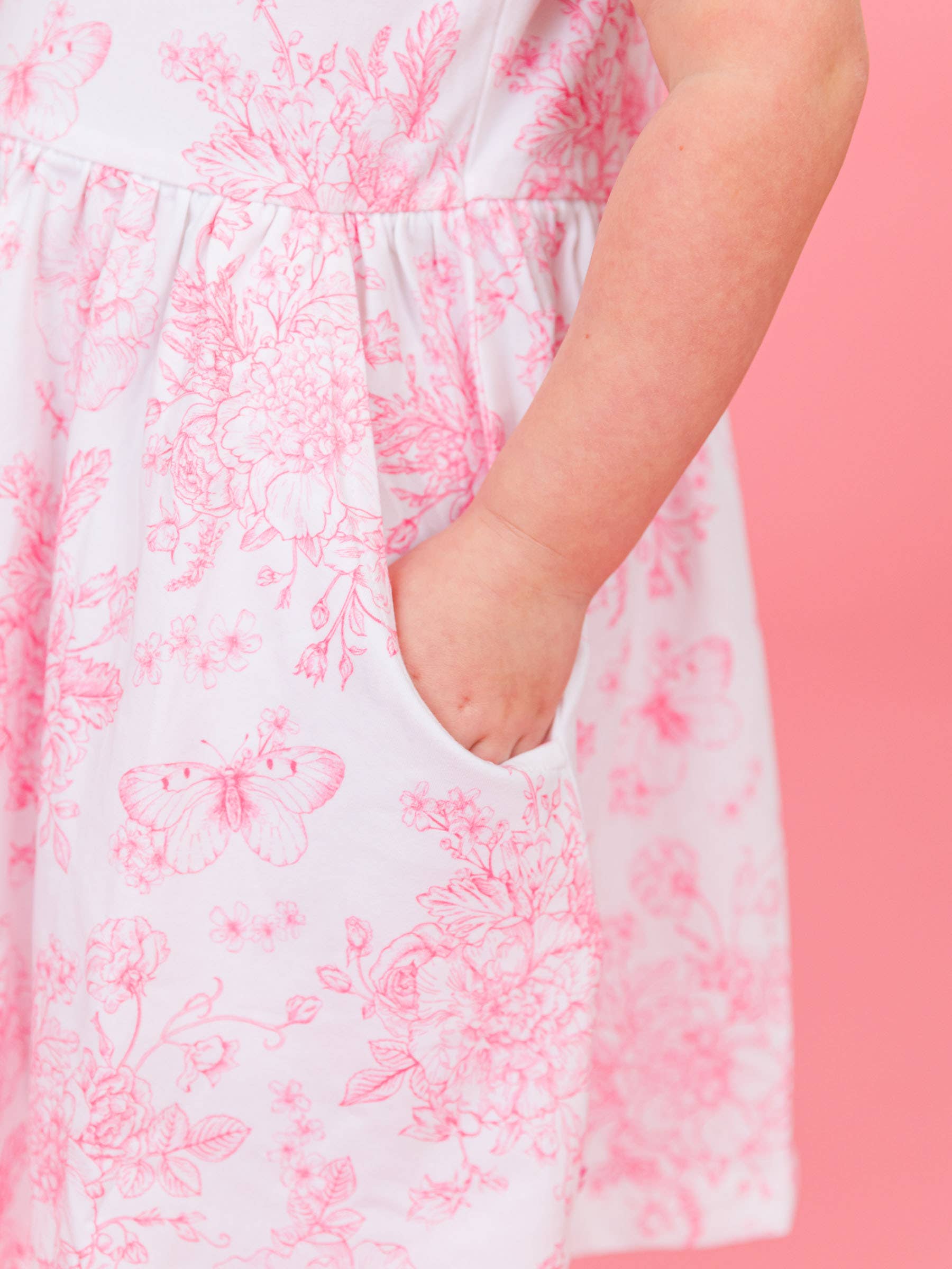 Rosa Flickors rosa fjärilsträdgård toile puff kortärmad klänning med rosett och snurrkjol för wholesale på Faire3