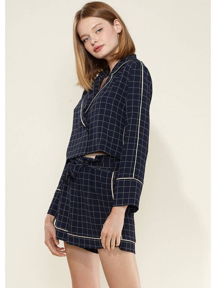 Nurode's Grid Print Blouse in Navy Plaid for wholesale on Faire