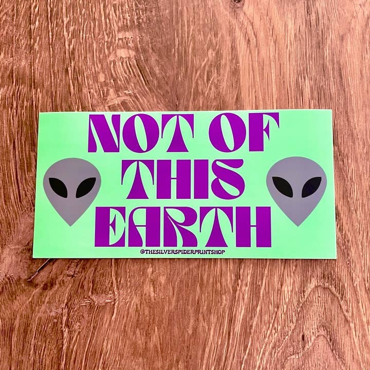 Autocollant de pare-chocs Not of this Earth alien UFO Roswell sarcelle pour la vente par The Silver Spider