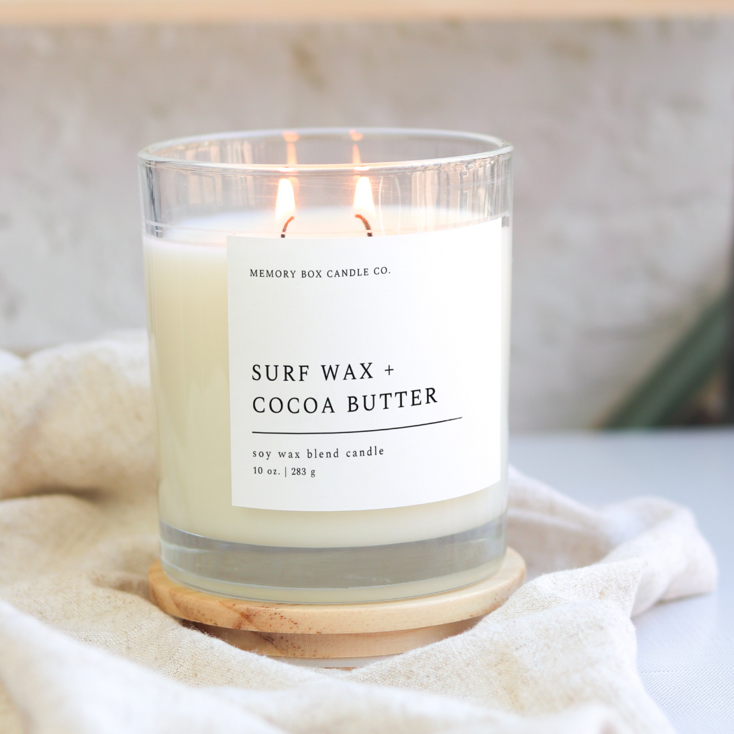 Wholesale Surf Wax + Cocoa Butter 10 oz. Clear Glass Soy Candle for your store Faire