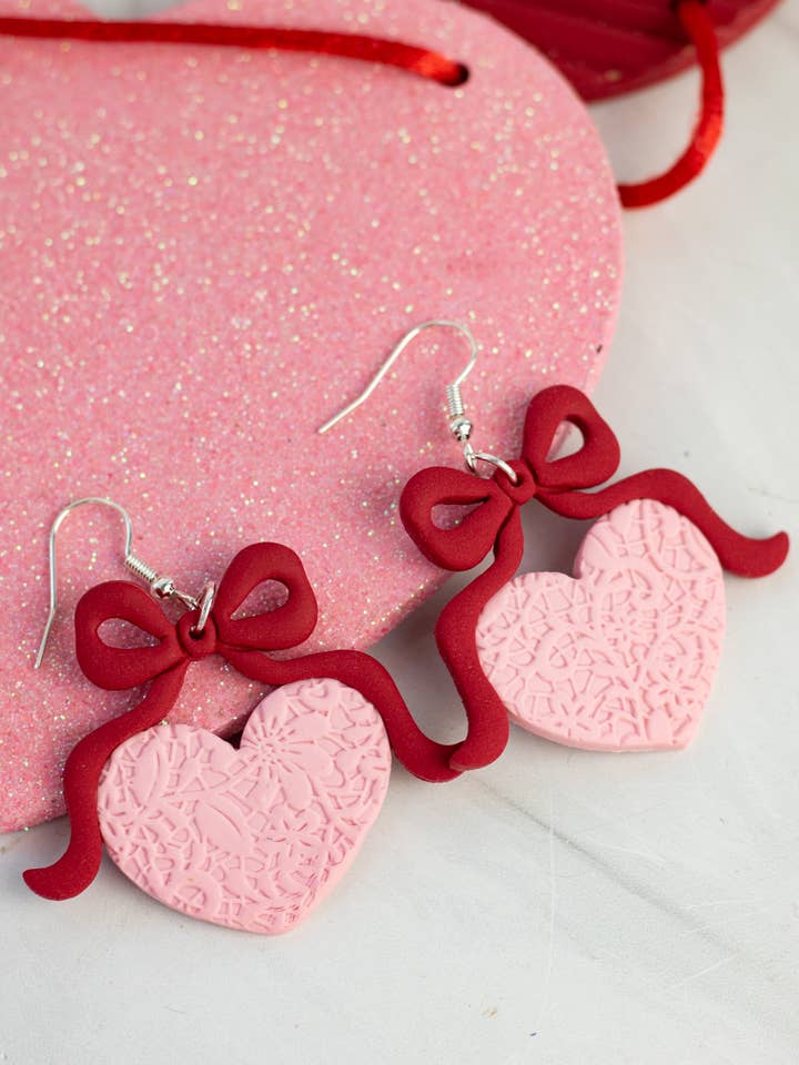 Romantic Bow Heart Dangles for wholesale by EJ Clay Co