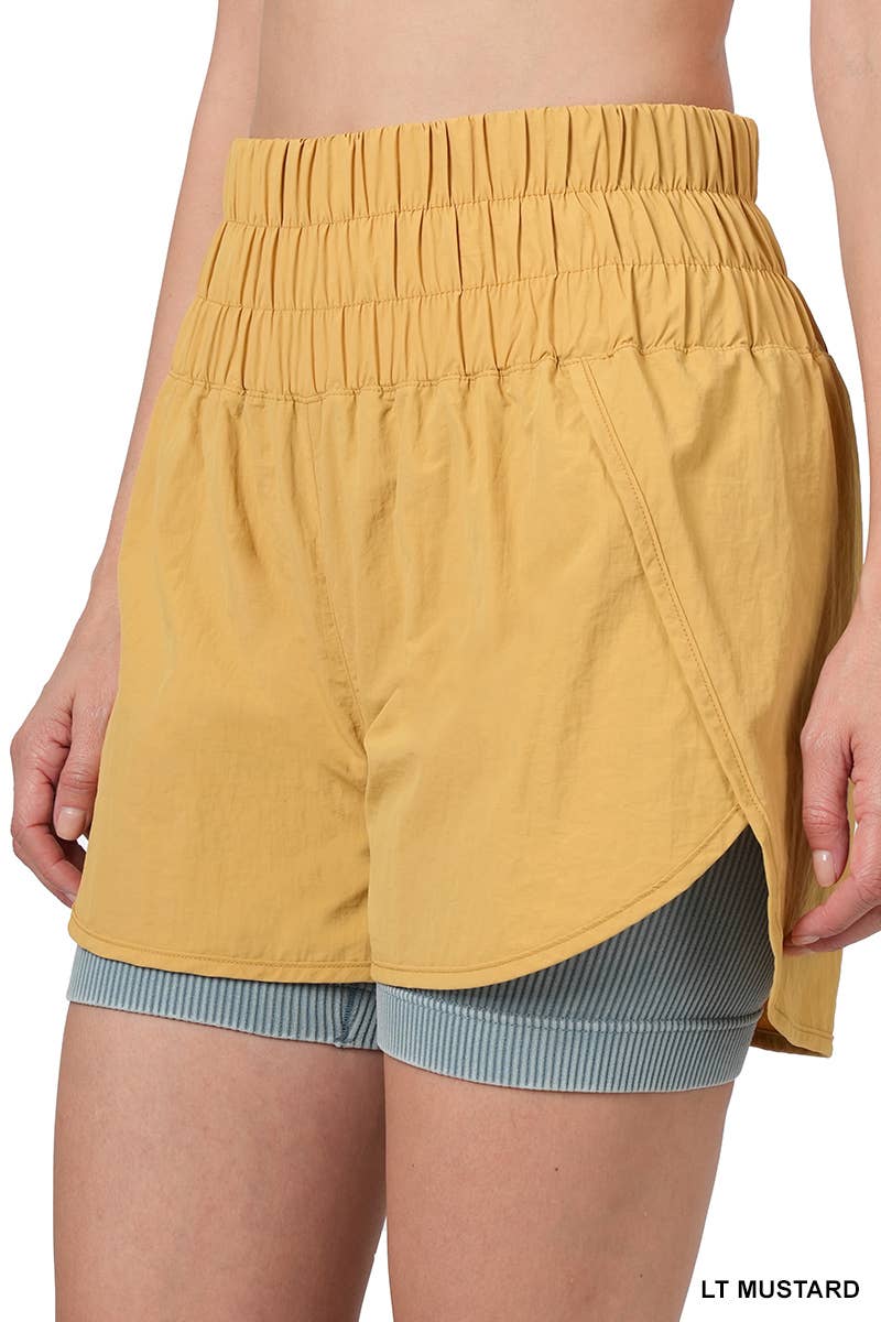 42POPS - Vente Short – femme - Short coupe-vent avec doublure et poche arrière en mesh32