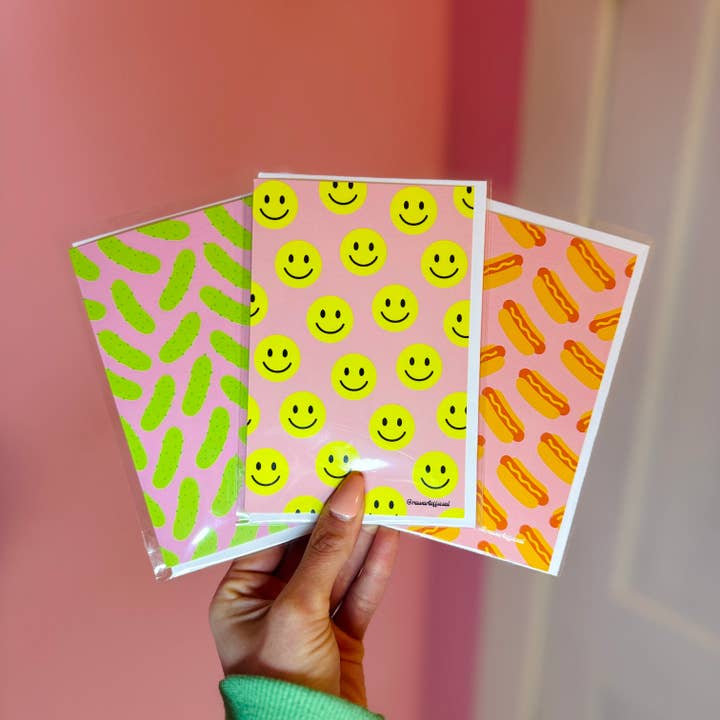 Retro Smiley Face Greeting Card: Bright Yellow Happy Face on Pink for wholesale by Hot Mess Paper Co.