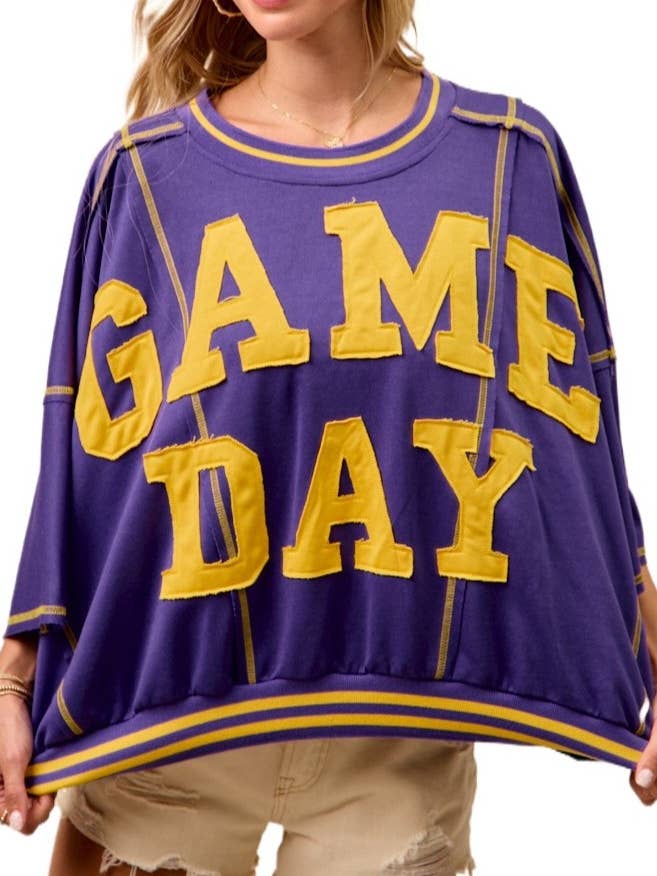 Top in spugna francese con dettagli a punto patchwork per il giorno della partita per la vendita all'ingrosso da parte di Vanilla Monkey