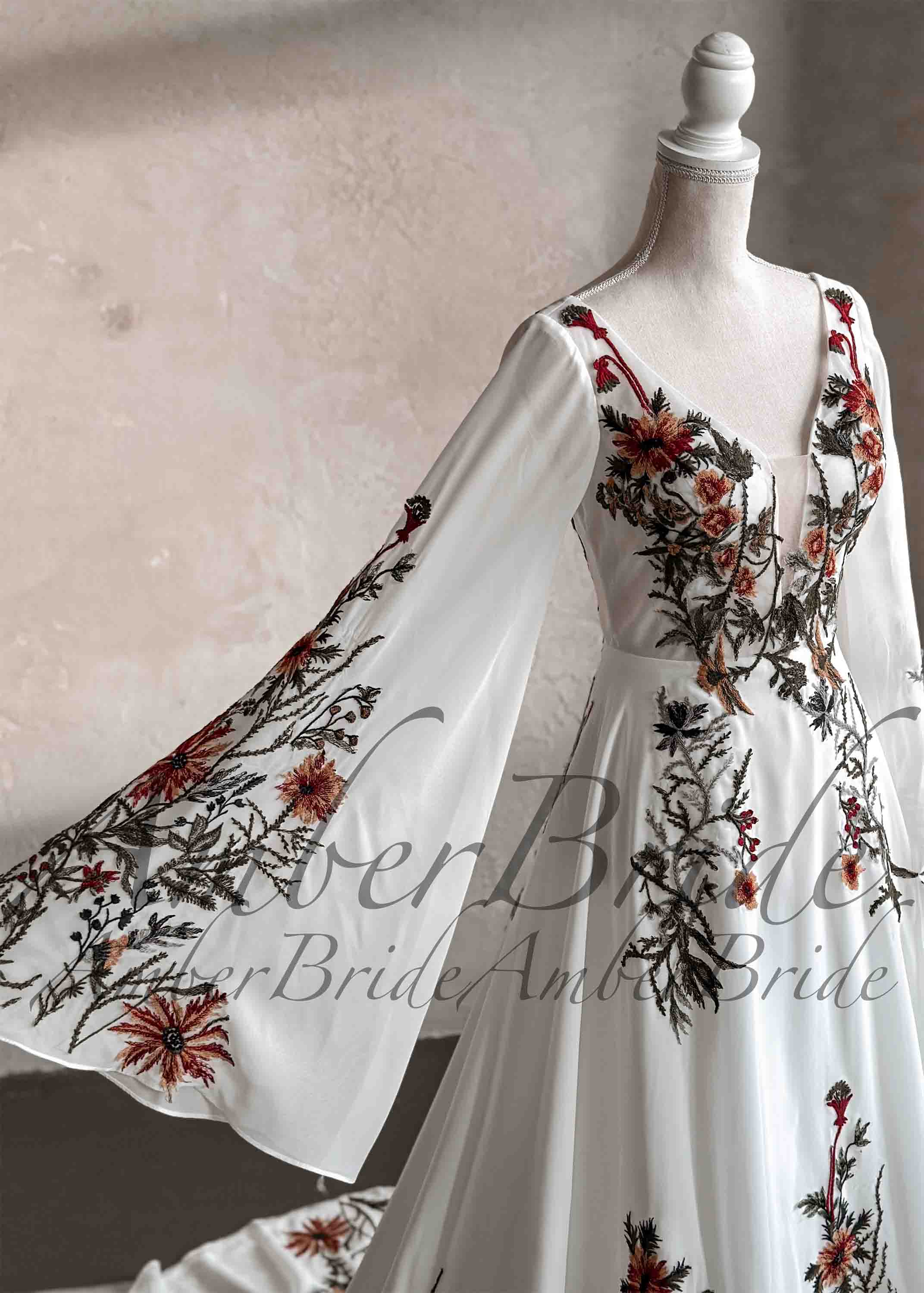 Amber Commerce Group, MB - Wholesale Gown - Women's - Embroidered Floral Details with Cape Sleeves and Chiffon Skirt2