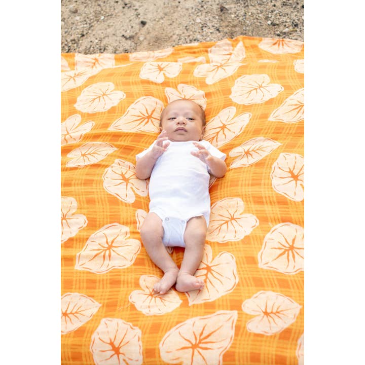 The Keiki Dept - Wholesale Swaddle - Baby - Caramel Orange Palaka Kalo Bamboo Muslin Kapa Moe (Swaddle Blanket)