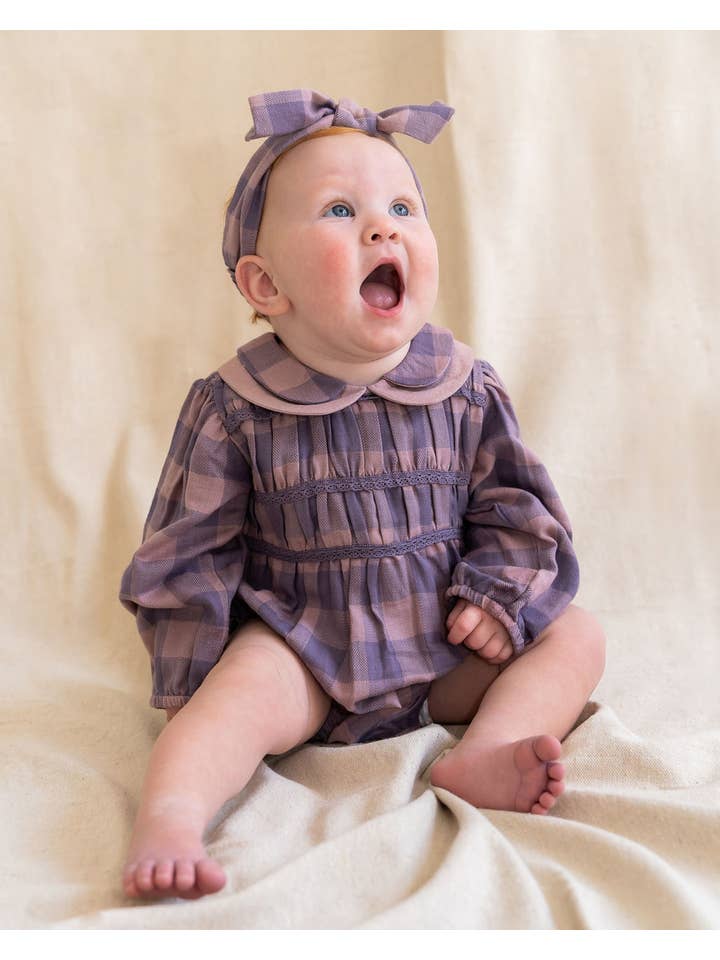 Lilac Smocked Peter Pan Gingham Baby Romper (Organic) for wholesale on Faire
