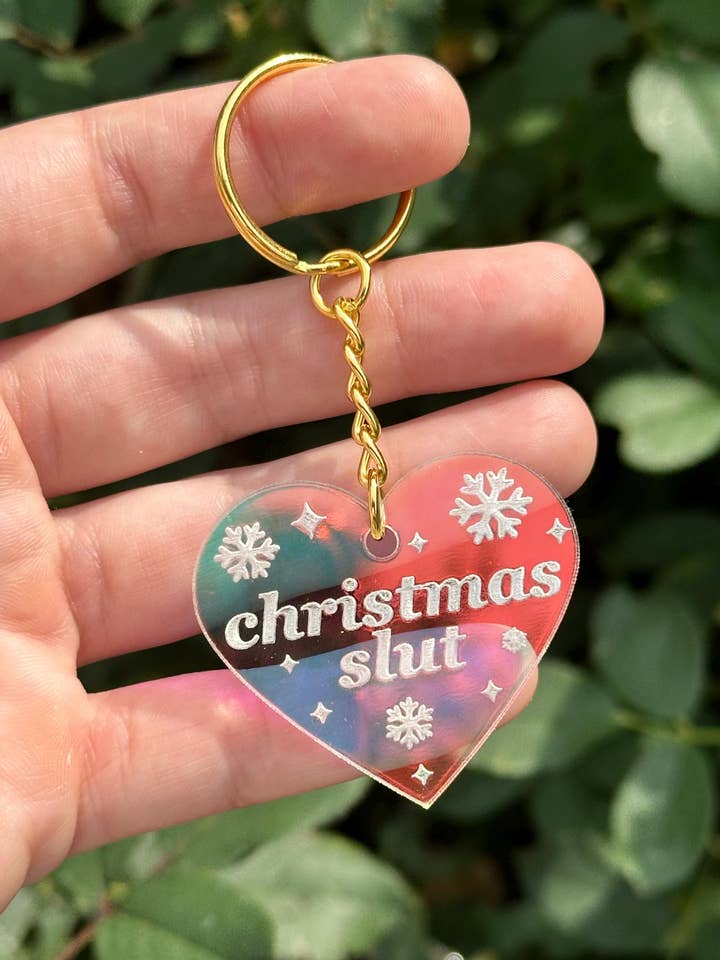 Christmas Slut Iridescent Acrylic Keychain for wholesale by ShlemonArt