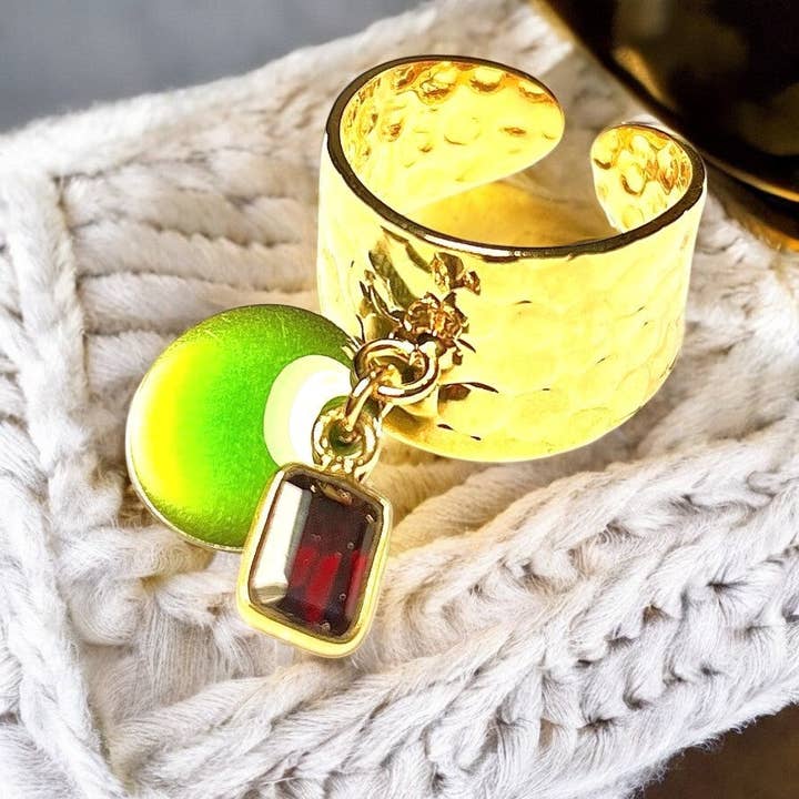 "Melissa" ring in fine gold with garnet stone and enameled sequin for wholesale by TOURMALYN
