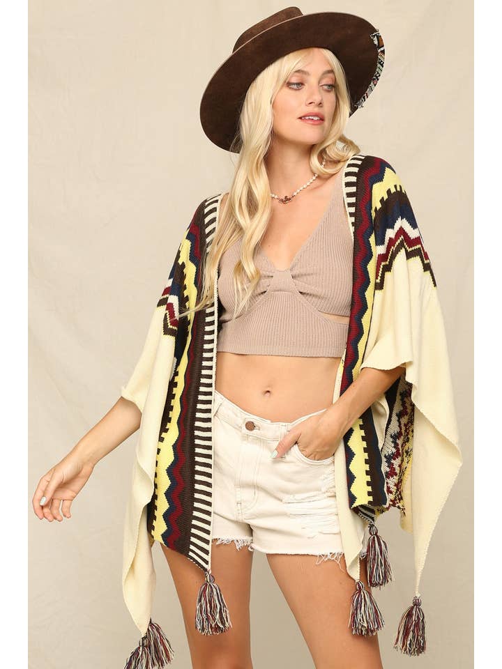 Ivory This Cozy Poncho A Boldly Printed With Tassels for wholesale on Faire4