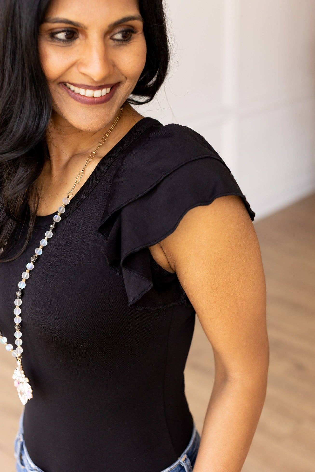 The Eloise Ruffle Sleeve Bodysuit, Black for wholesale on Faire3