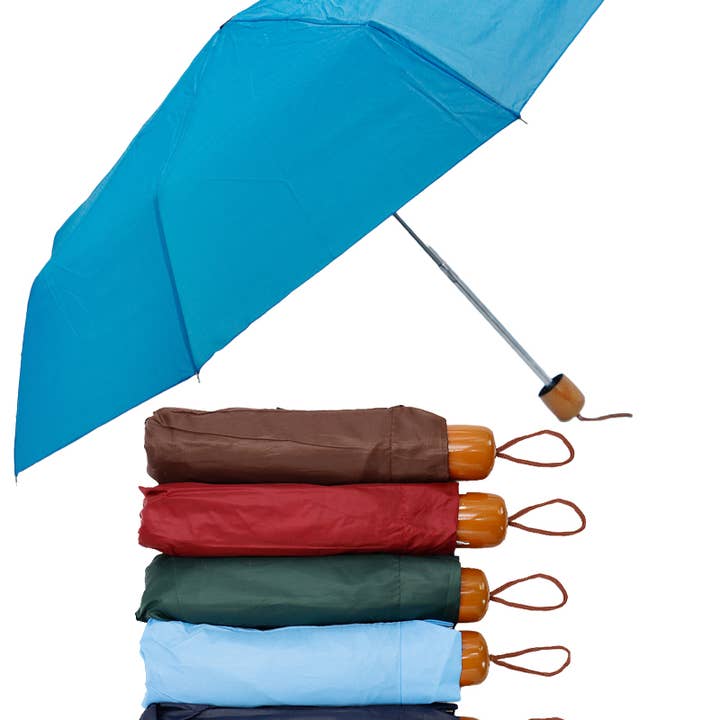 SURTIDO Paraguas compacto manual sólido de 8 paneles y 3 pliegues de venta al por mayor en Faire