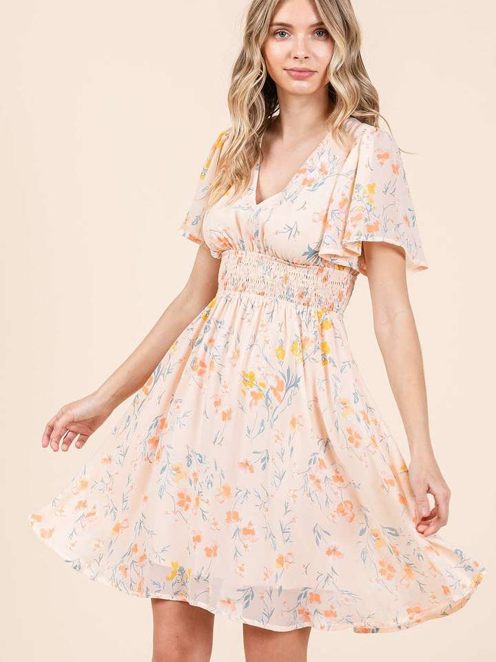 MINIKJOLE MED BLOMSTERPRINT MED SMOCHET TALJE for engroshandel hos mittoshop