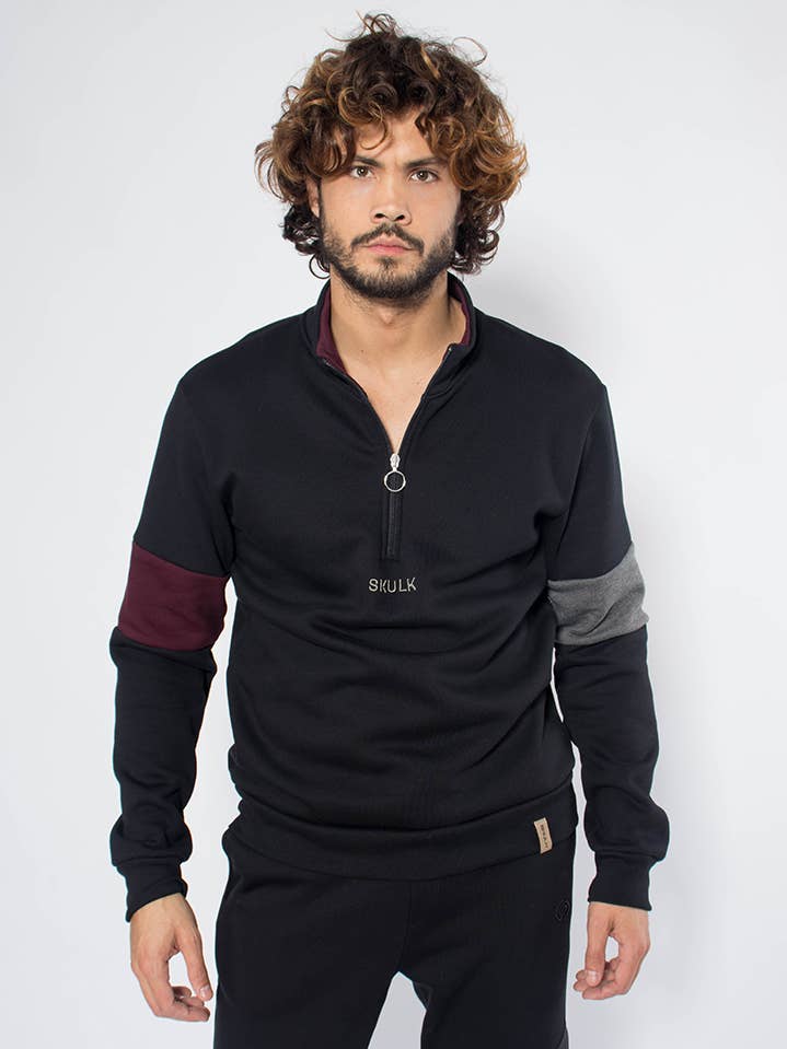 Felpa Huxley nera con collo alto e zip per la vendita all'ingrosso da parte di StockNow Unipessoal