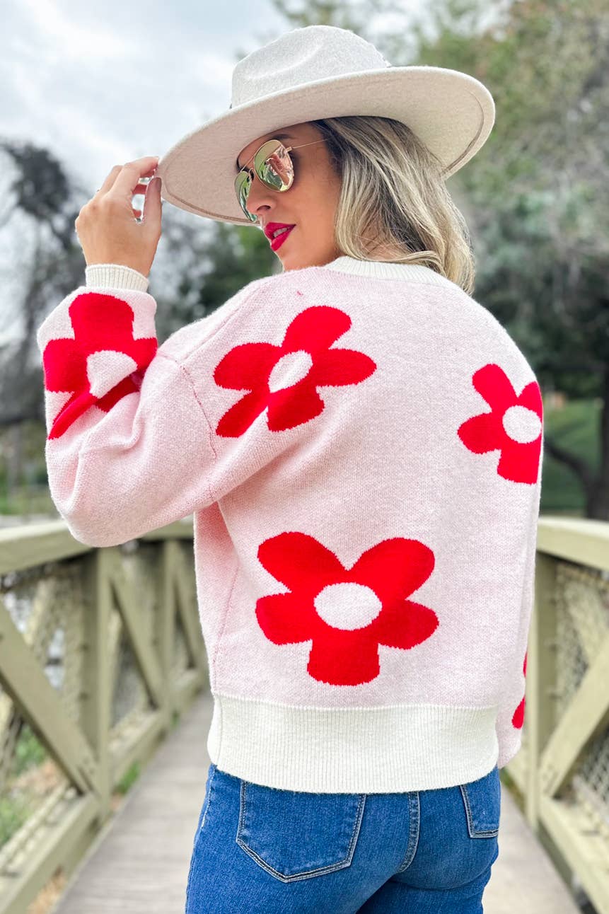 Rouge Pull douillet en tricot imprimé de marguerites rouges en vente sur Faire5