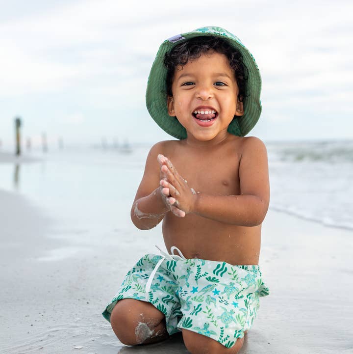 Green Save the Sea Turtles Boys Swim Trunks for wholesale on Faire1