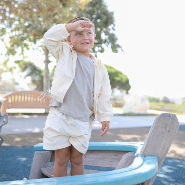 Ensemble coupe-vent et short - crème pour la vente par Rivi & Kin