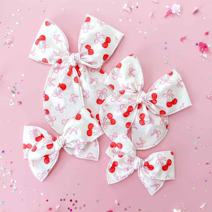 Coquette Cherry Bows for wholesale by Tiny Wonders Bows