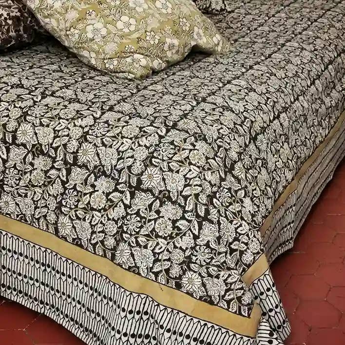 Cotton bedspread printed with flowers in Pushkar block print for wholesale by Nayda Diaries
