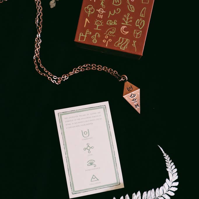 Green Glyphs Pendulum for wholesale by Prisma Visions