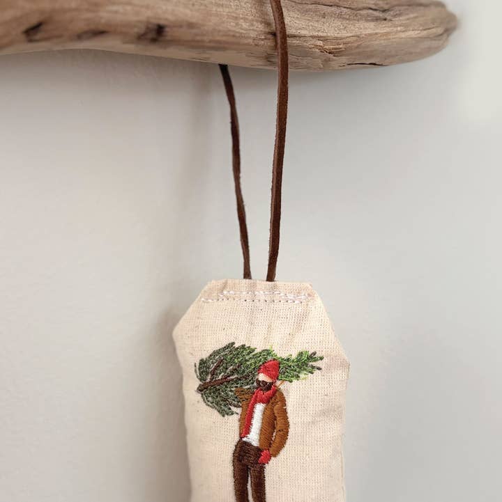 Man with winter tree ornament for wholesale by Saturna Outdoor Research