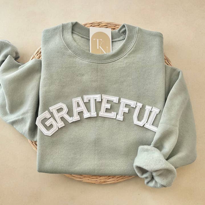 Sudadera Grateful, Sudadera Thankful
para venta al por mayor de Threads And Needles, INC.