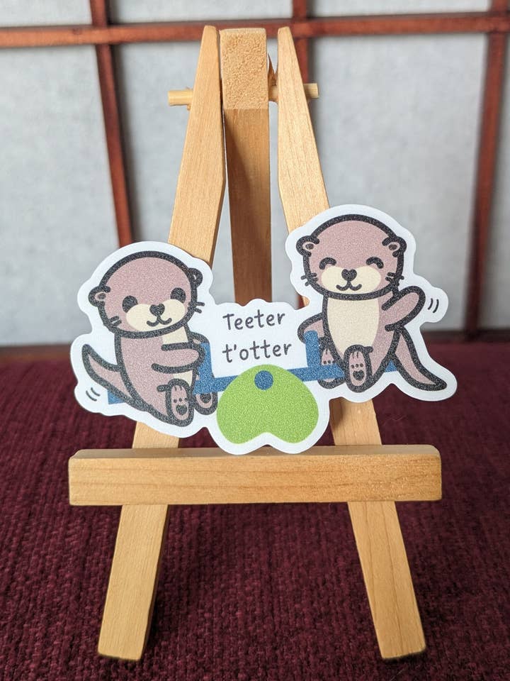 Teeter totter cute otter pun vinyl waterproof sticker for wholesale by Lia Mayu Designs