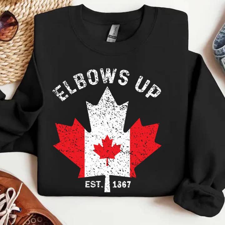 Elbows Up Canada Shirt, Maple Leaf Proud Canadian Sweatshirt for wholesale by NVC Ecommerce LLC