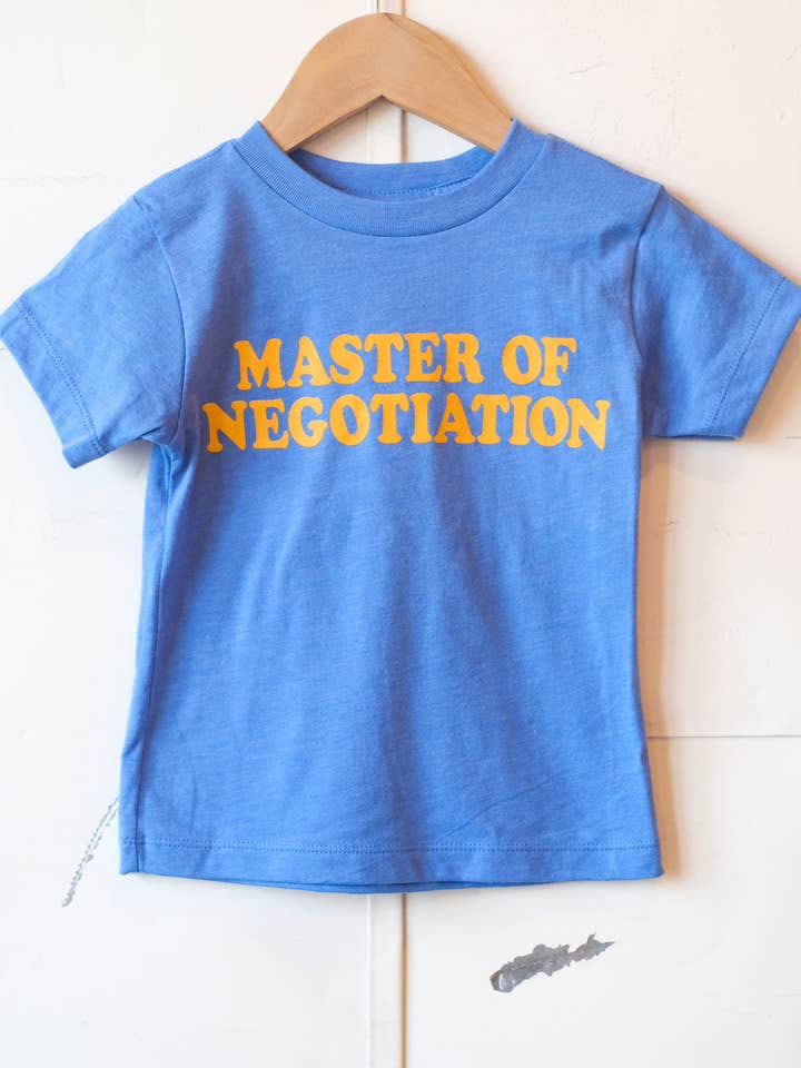 Vintage Blue Master of Negotiation | Kids Graphic Tee | Sizes 2T - YL for wholesale on Faire