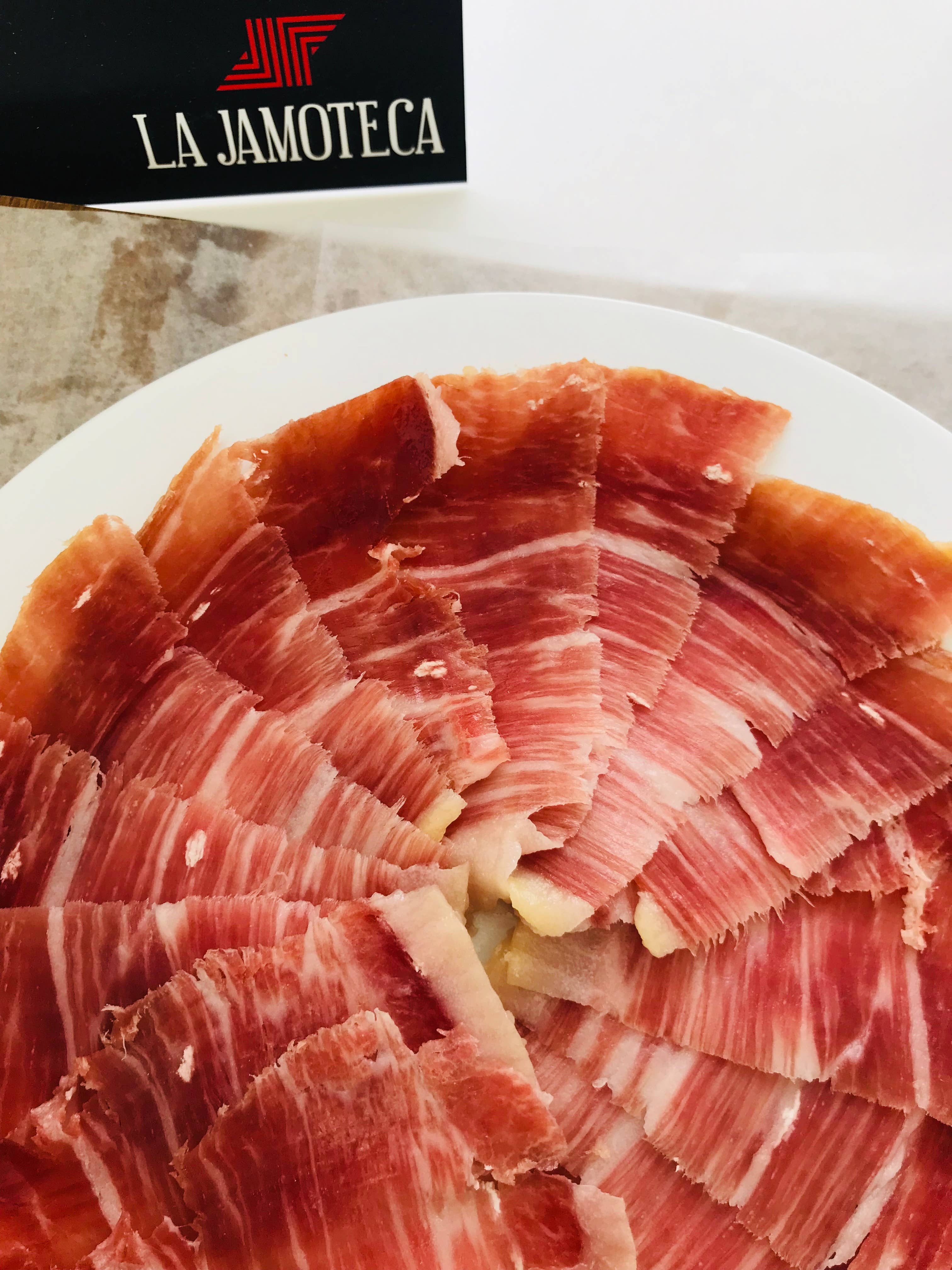 LA JAMOTECA - Wholesale Ham - Hand carved Acorn Fed 100% Iberico Pork Ham. 2.5oz plate0
