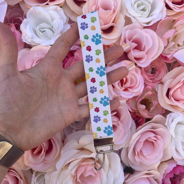 Paw Print Wristlet Keychain Fobs || Dog Mom Gift and other Purchase Wholesale paw print keychain. Free Returns & Net 60 Terms on Faire trending on Faire.