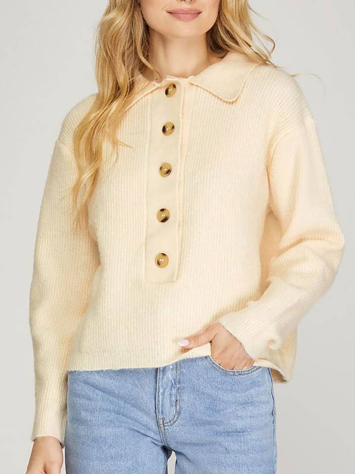 Maglione con scollo a V, abbottonatura e maniche lunghe. per la vendita all'ingrosso da parte di ROUSSEAU