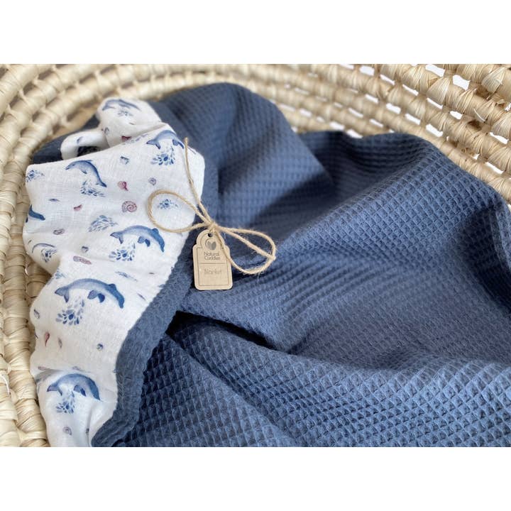Newborn blanket - dark jeans dolphins for wholesale by Natural Cuddles