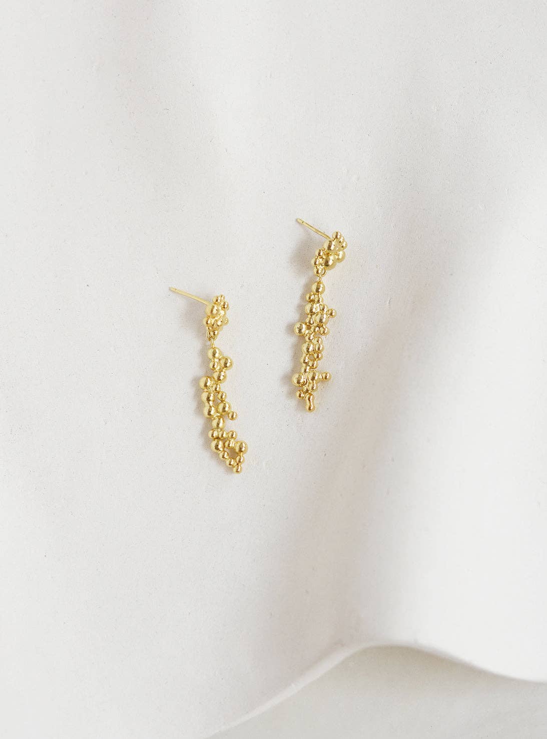 Gold Deia earrings for wholesale on Faire1