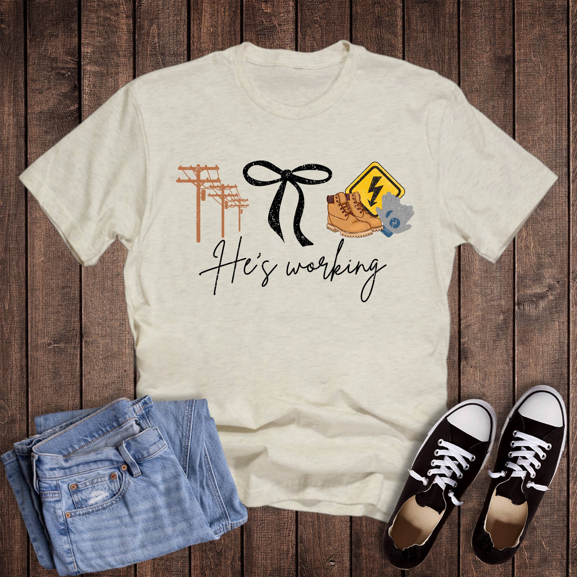 Oat He is Working Lineman Graphic Tee for wholesale on Faire0