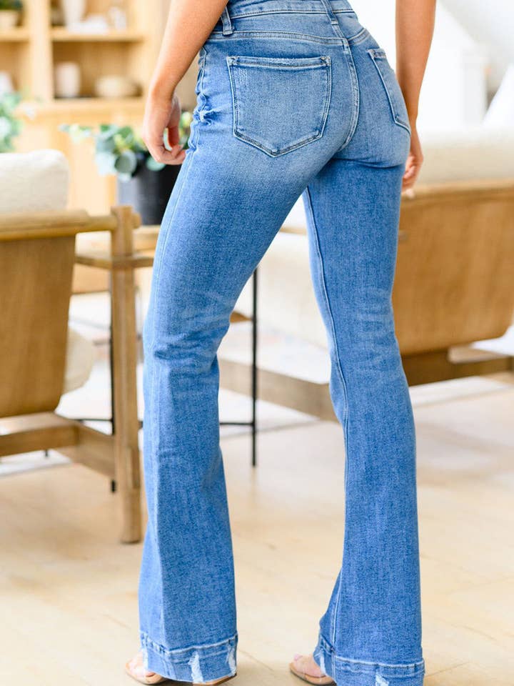 Sky Blue Distressed Medium Wash Flare Jeans for wholesale on Faire