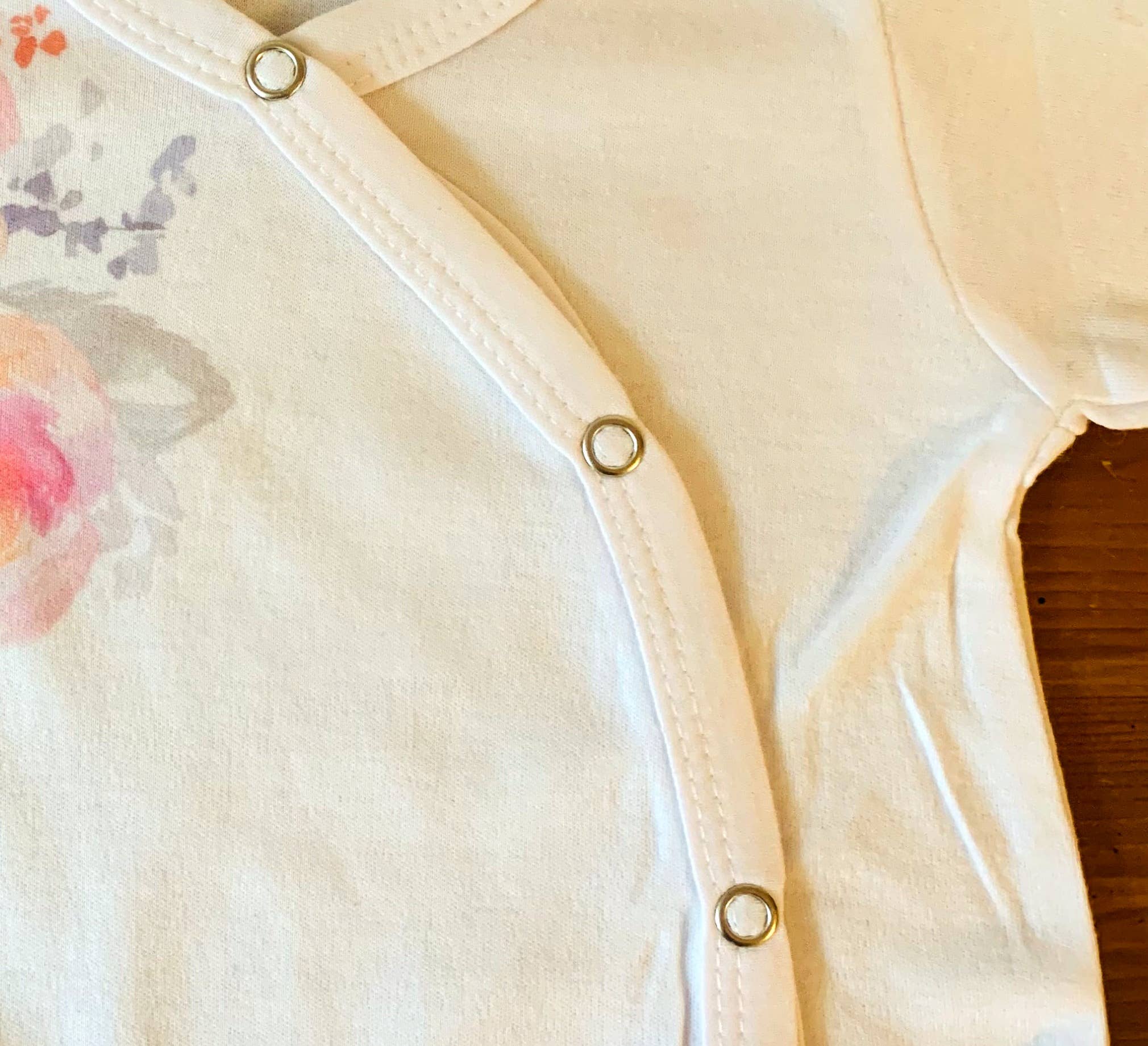 Cloud White Baby Footed Romper - Watercolor Flowers for wholesale on Faire2