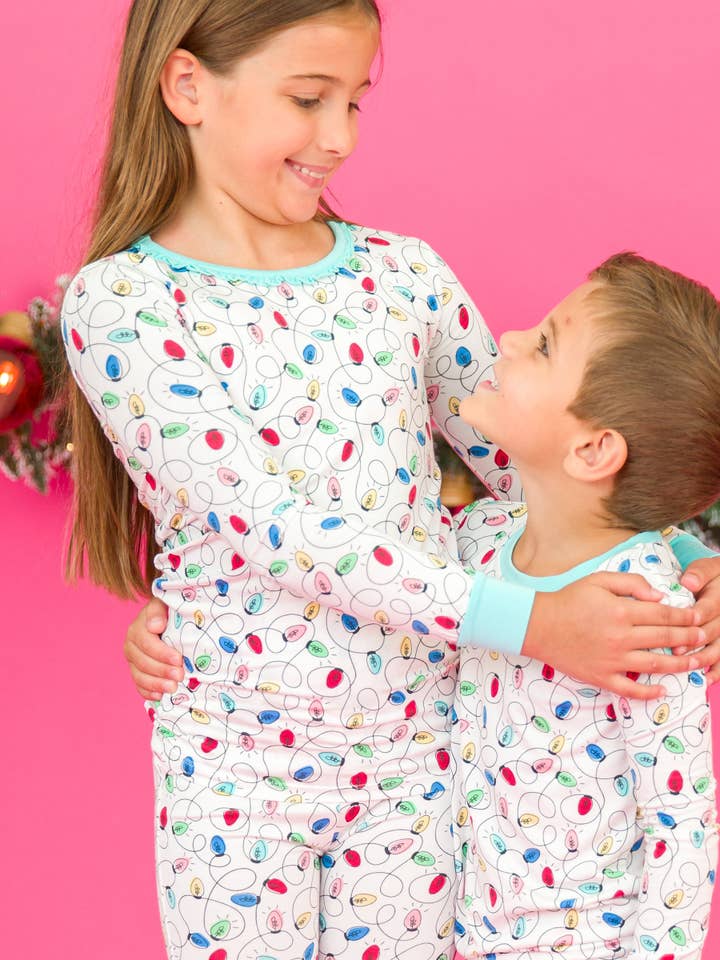 Off White Girls Holiday Lights Bamboo Viscose Ruffle Long Sleeve Pajama Set
for wholesale on Faire