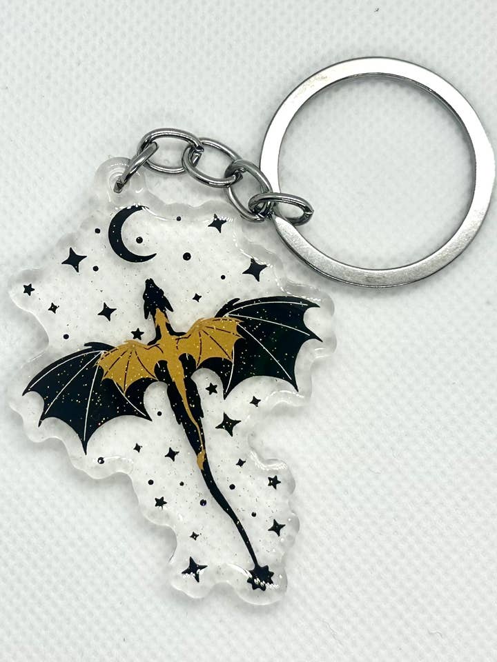 Black & Gold Dragons Fourth Wing Glitter Acrylic Keychain for wholesale by A Little Crafty Fox